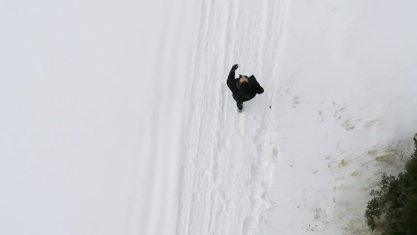 A person walking in the snow