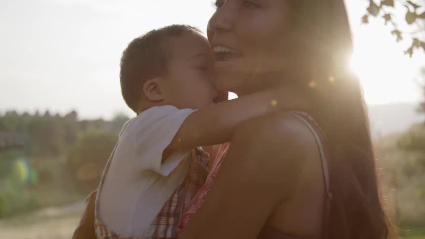 A woman is holding her child