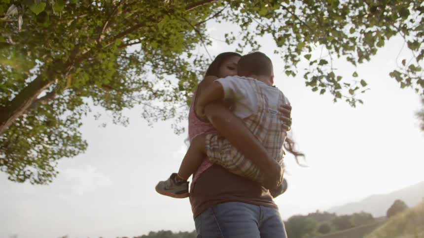 A woman is carrying her child