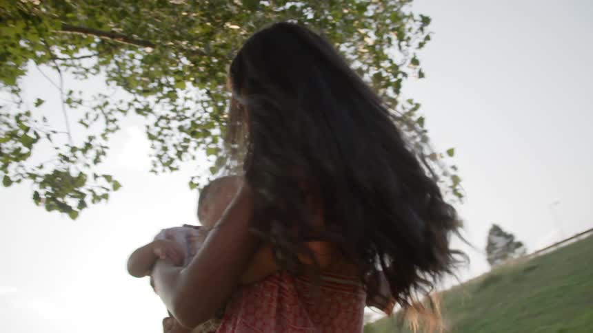 Woman carrying her child