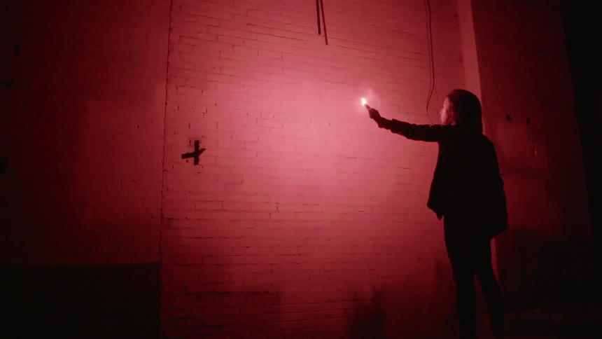Woman is holding a flare