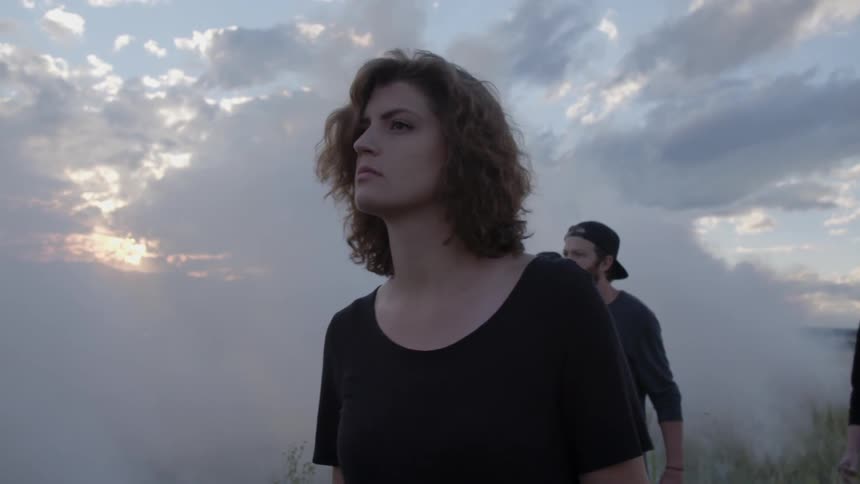 A woman is walking with friends
