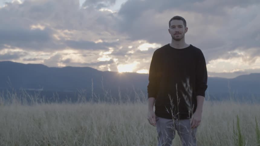 Man is standing in a field