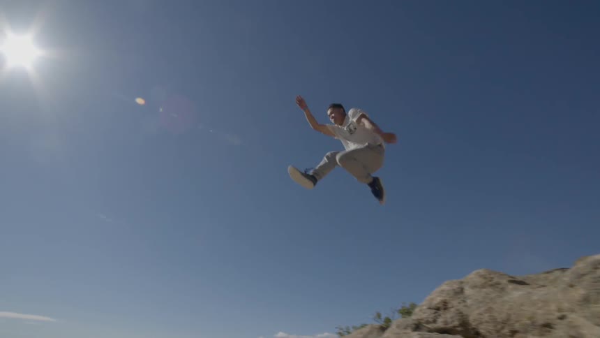 A person runs up a peak