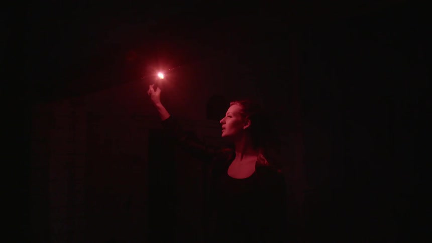 Woman is holding a flare