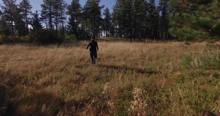 A woman is running down the path