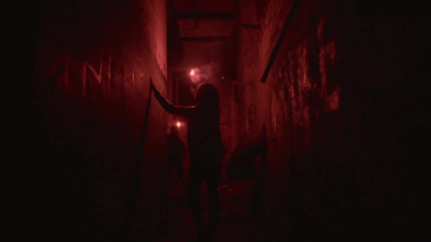 A person holding a flare