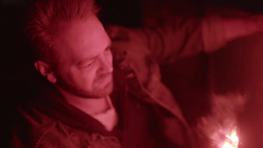 A person holding a flare