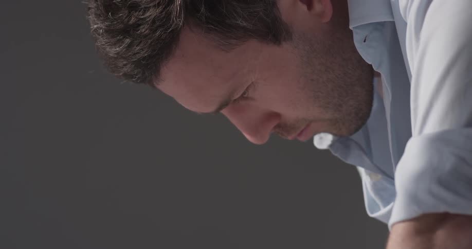 A man is looking down inside