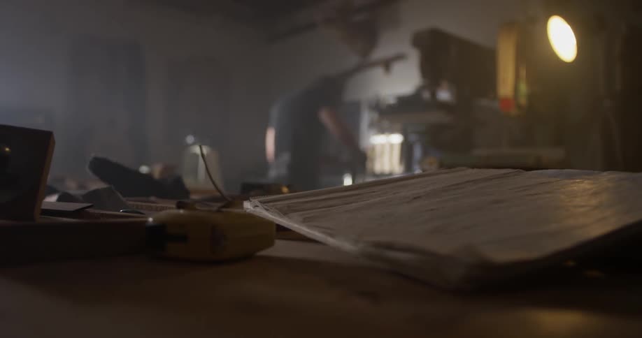 Working late into the night the woodworker perfects his craft
