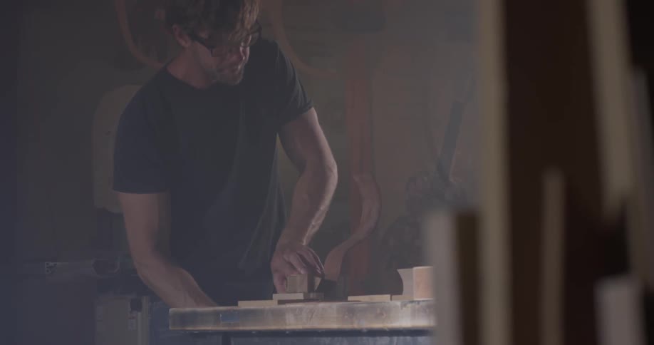 A man works with tools in his workshop
