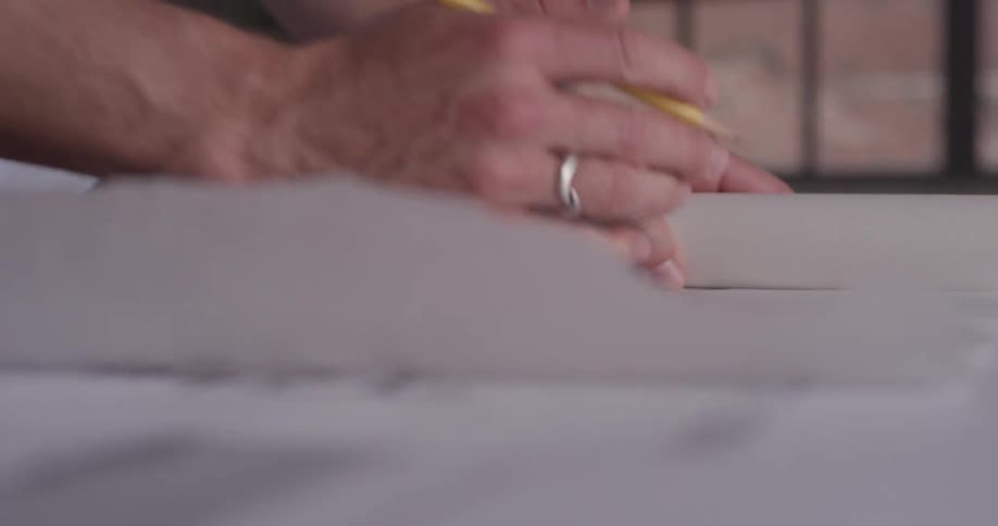 A person sketching on a piece of paper