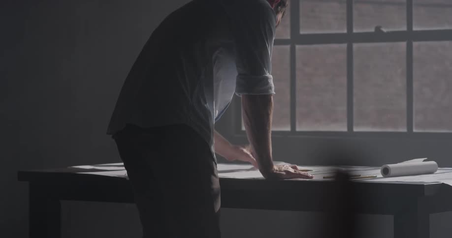 A person is writing on a piece of paper
