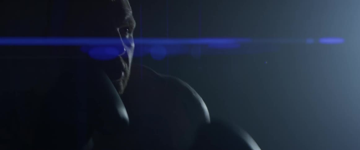 A man is boxing indoors