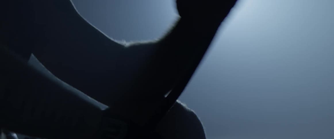 A person is putting athletic tape around their wrist