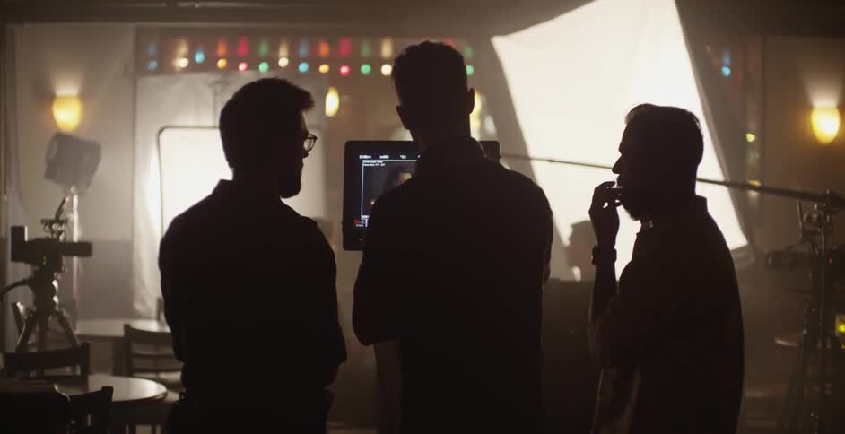 People chatting on a movie set
