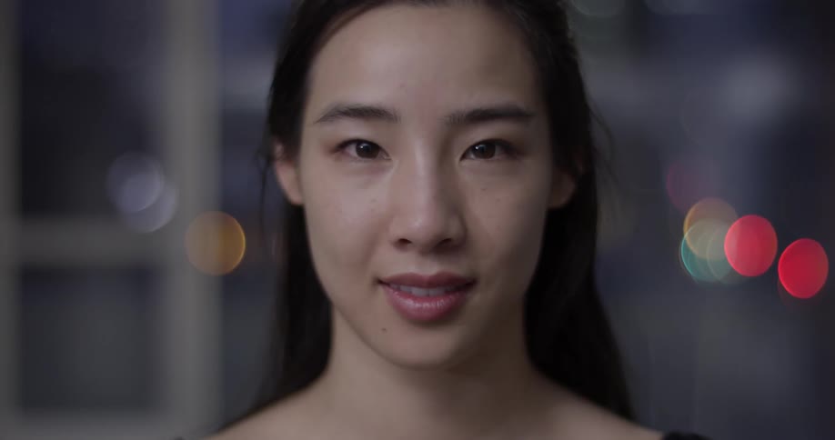 A woman is smiling indoors