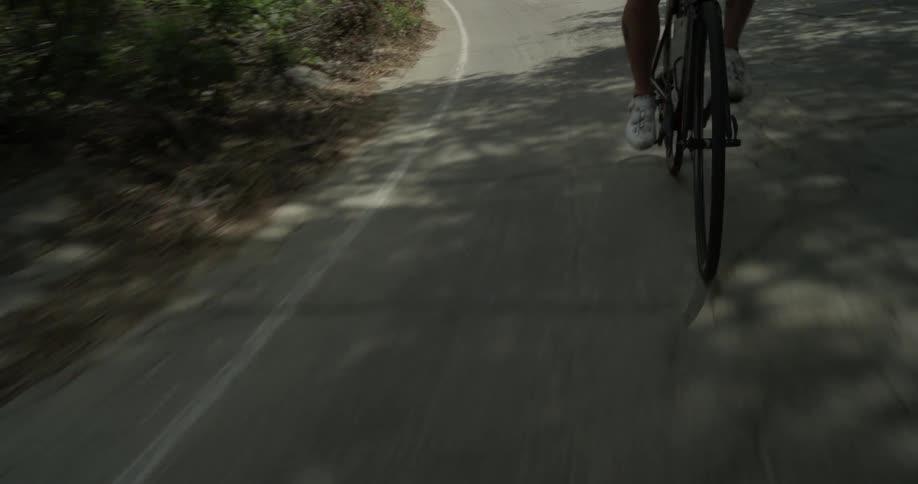 Cyclists On Hilly Roads