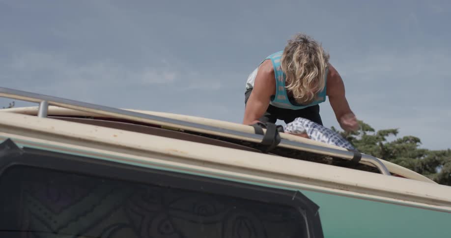 Man Driving To Beach And Surfing