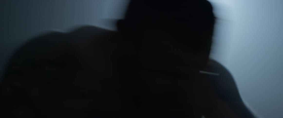 A man punching with boxing gloves