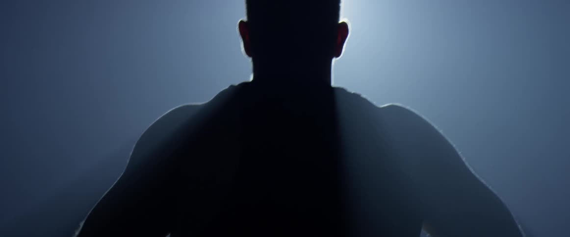A man is walking in the dark