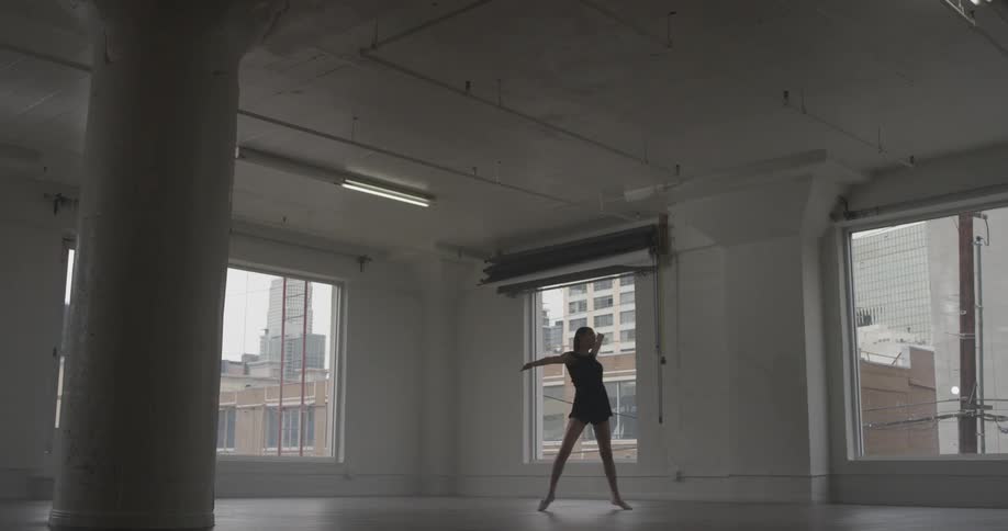 A woman dancing in a studio