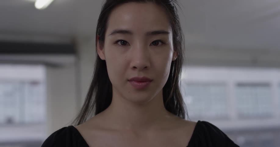 Woman stares at camera