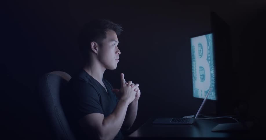 Man Coding On Computer In Dark Room
