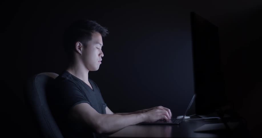A hard working student stay at work late into the night to prepare
