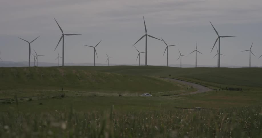 A lot of windmills that are rotating