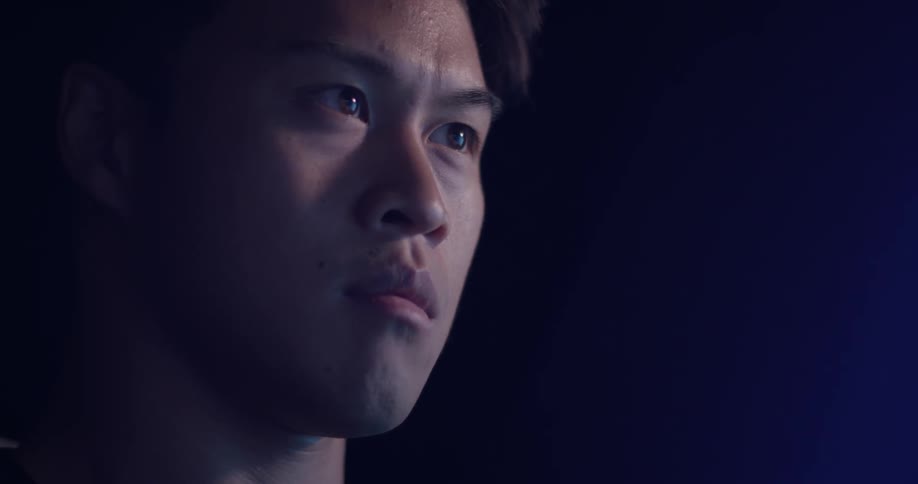 Man looking and thinking in a dark room
