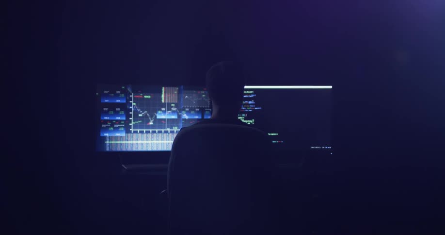 Man Coding On Computer In Dark Room