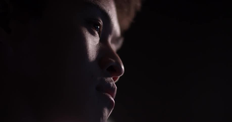 Man in the dark looks around