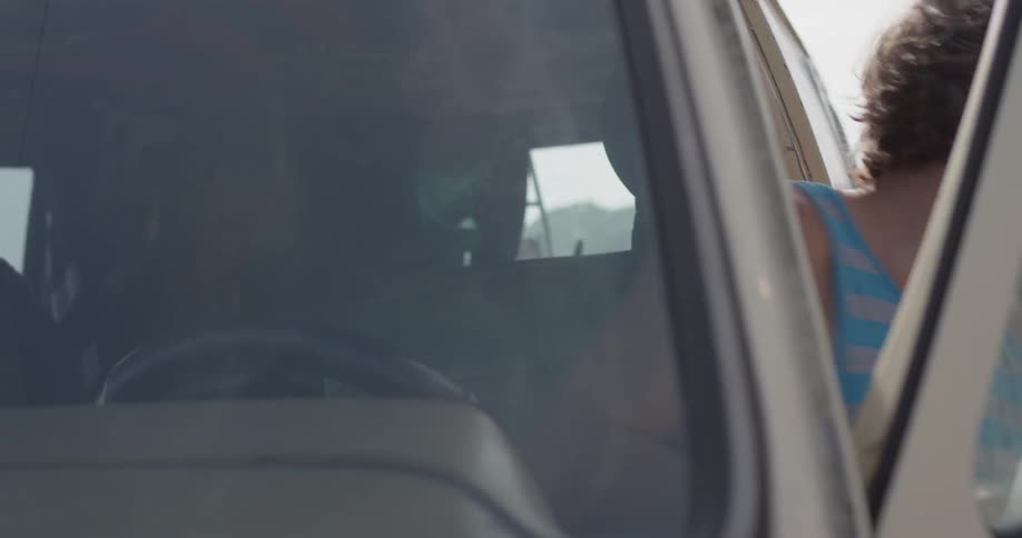 Man opens the door and gets out of his van
