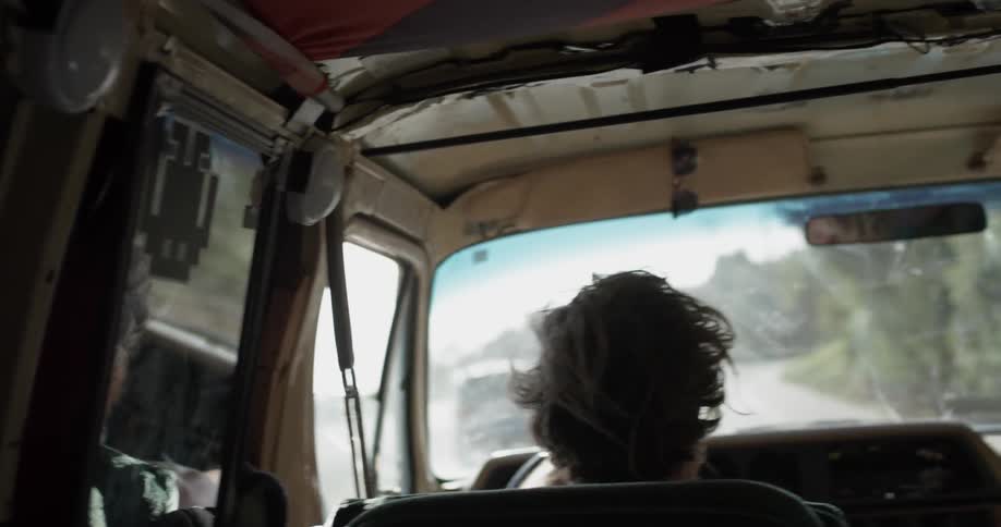 Man Driving To Beach And Surfing