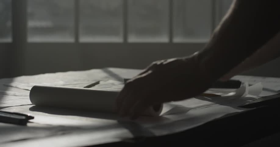 A person sketching on a piece of paper