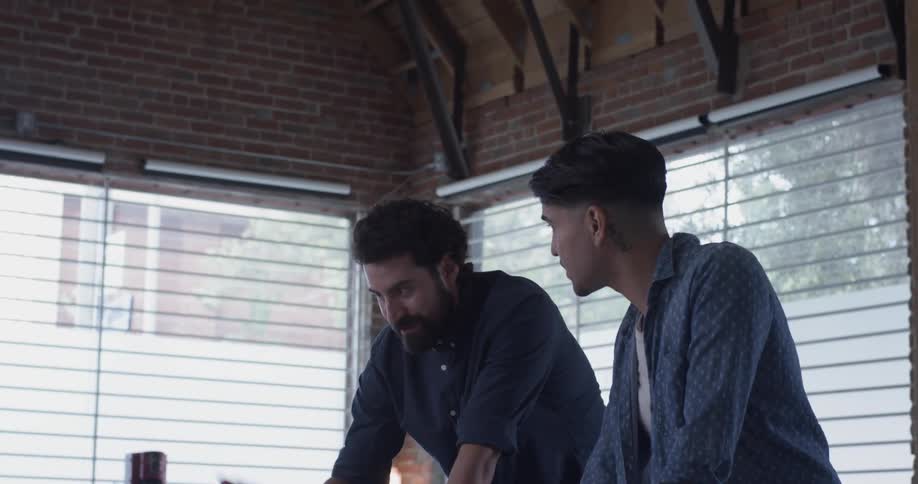 Co Workers Collaborating In Office