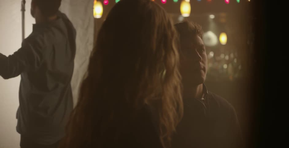 A director talks to an actress in between takes