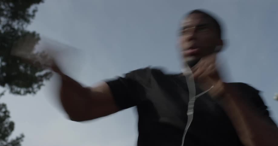 A man is punching his arms, right and left
