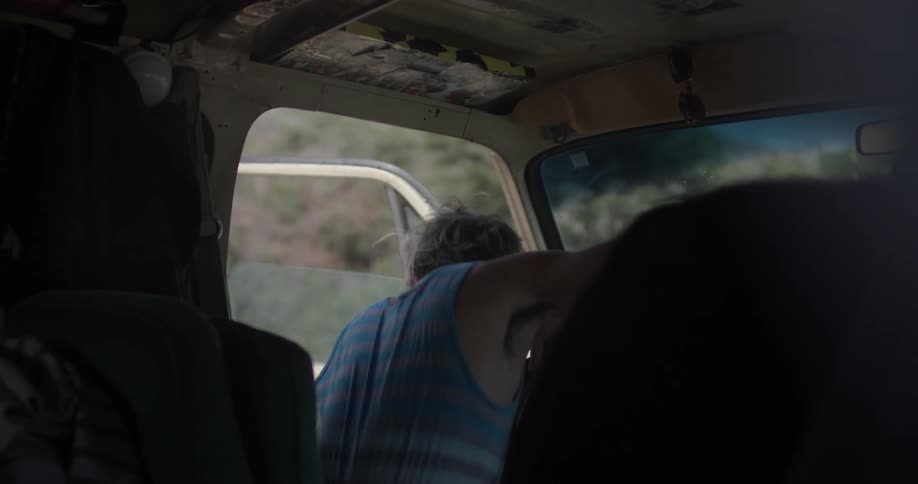 Man gets into his van in the afternoon