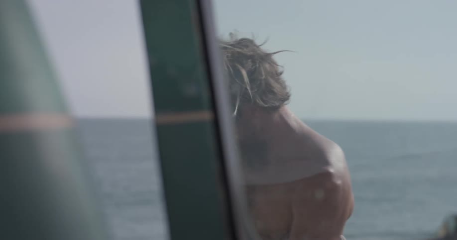 Man Driving To Beach And Surfing
