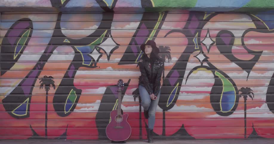 Girl Playing Guitar By The Beach