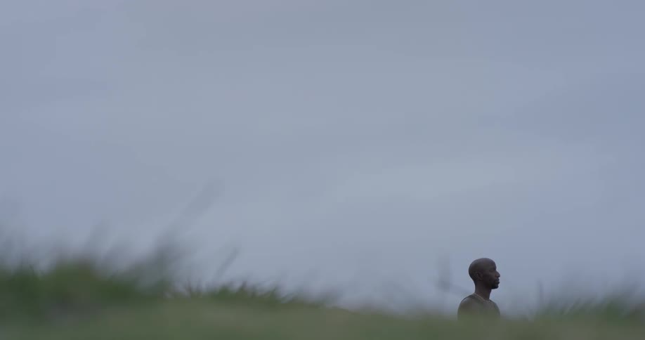 Man Meditating Outside By The Beach