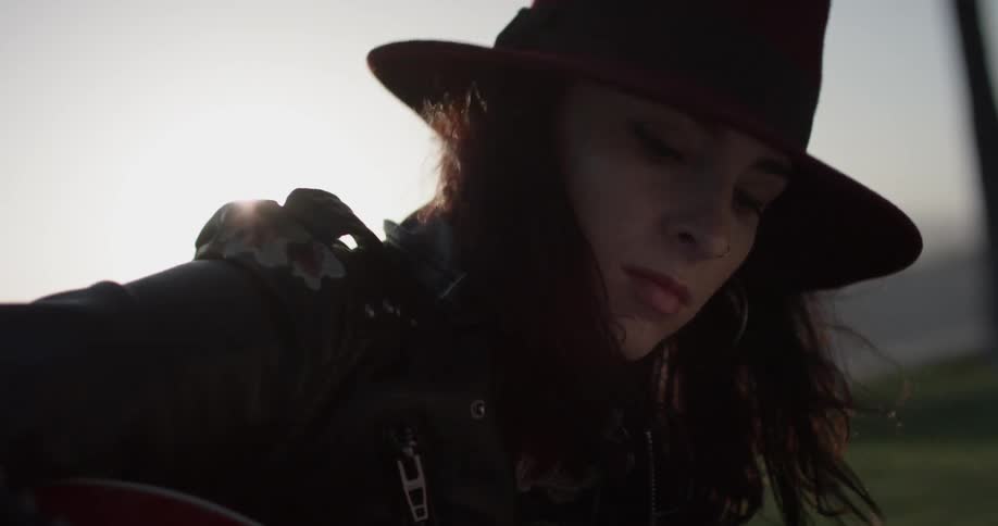 Girl Playing Guitar By The Beach