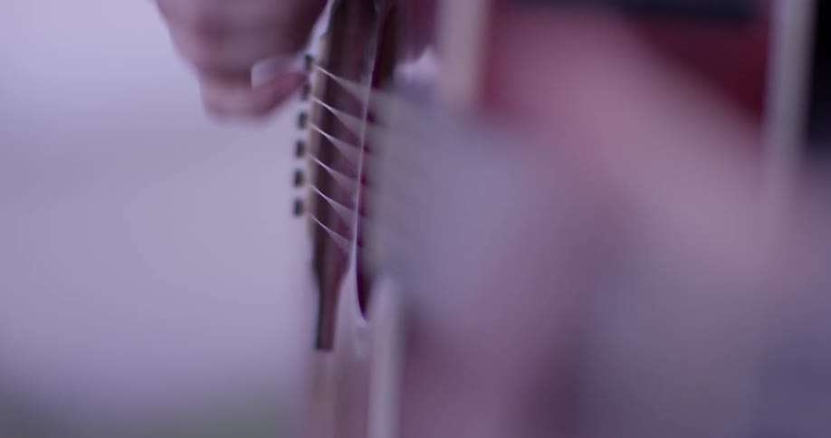 Girl Playing Guitar By The Beach