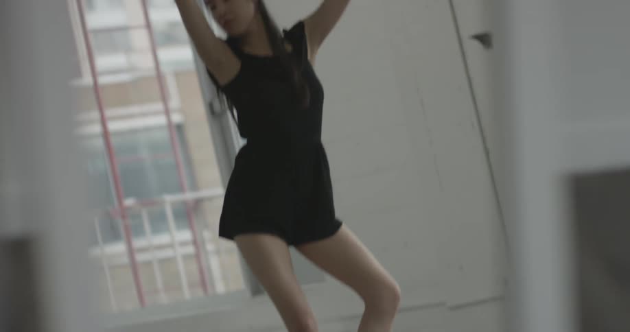 Woman dancing ballet in a studio