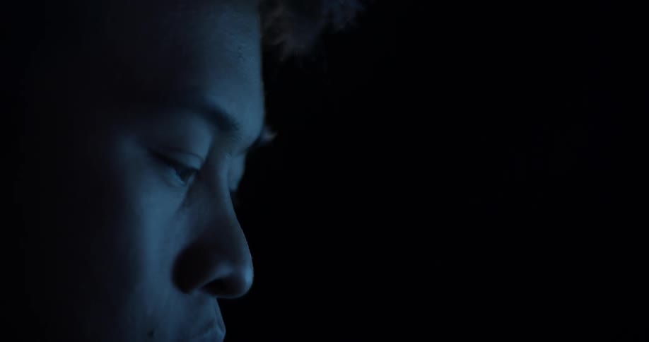 A man's eyes moving quickly at what he is looking at