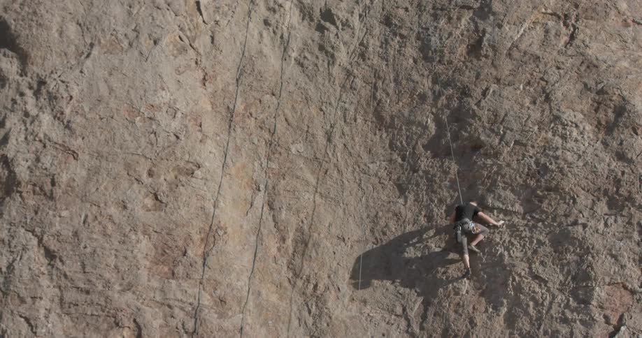 A man rock climbing up a cliff