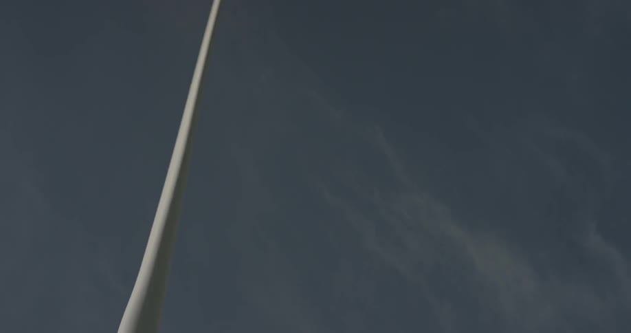 A windmill rotating on a clear day