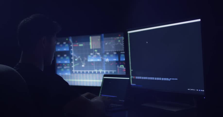 Man Coding On Computer In Dark Room